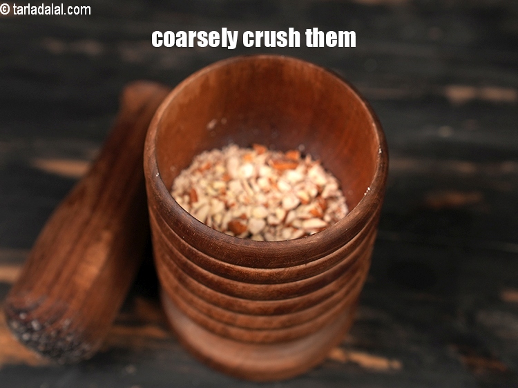 Step 7 – <p>Coarsely crush them in a mortar pestle.</p>