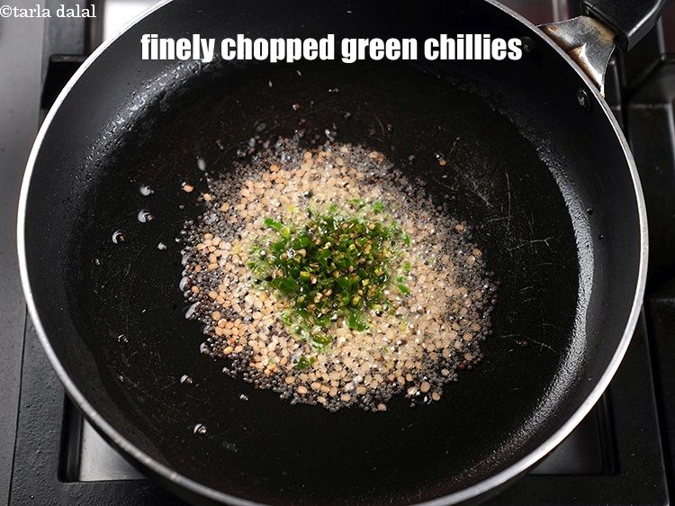 Step 12 – Add&nbsp;1 tbsp&nbsp;finely&nbsp;<a href="https://www.tarladalal.com/glossary-chopped-green-chilli-820i">chopped green chillies</a>.