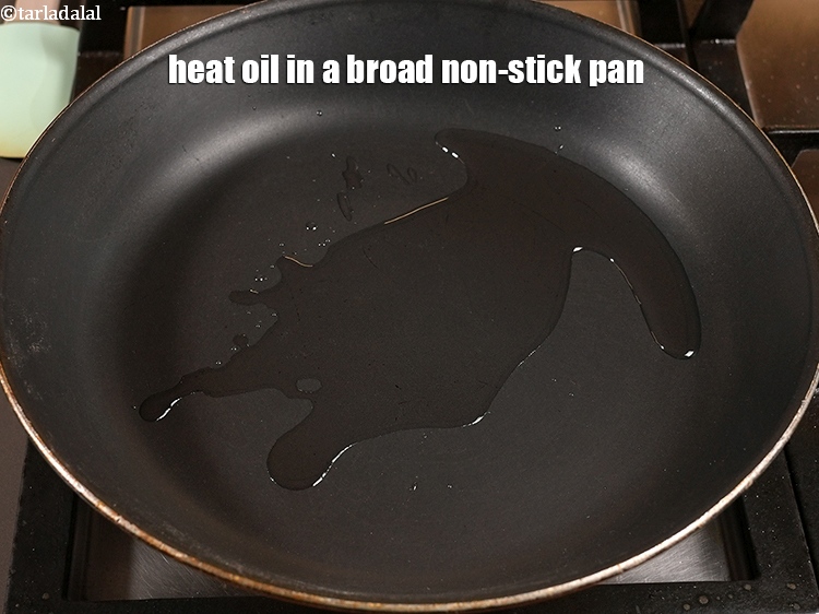 Step 7 – Heat 1 tbsp <a href="https://www.tarladalal.com/glossary-oil-671i">oil</a> in a broad non-stick pan.