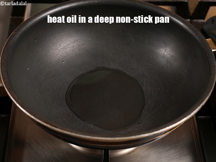Step 7 – Heat 3 tbsp oil in a deep non-stick pan.