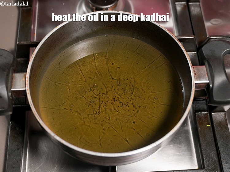 Step 7 – Heat the oil in a deep kadhai.