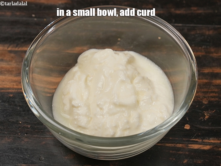 Step 7 – In a small bowl, add &frac12; cup <a href="https://www.tarladalal.com/glossary-curd-dahi-yogurt-yoghurt-383i">curd (dahi)</a>.