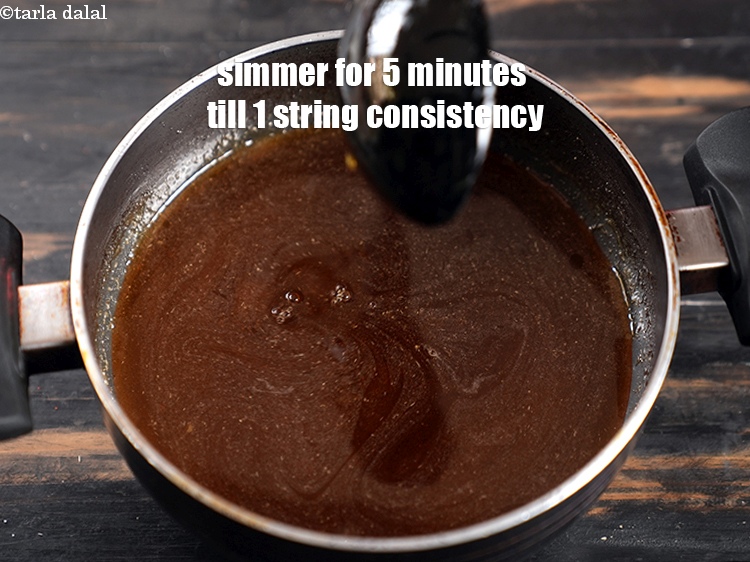 Step 8 – Simmer on medium flame for 5 minutes till the syrup is of 1 string consistency.