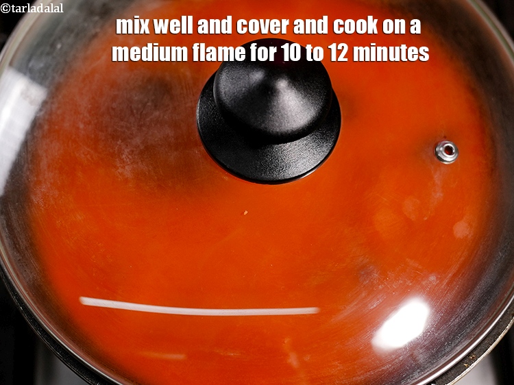 Step 52 – Mix well and cover and cook on a medium flame for 10 to 12 minutes, …