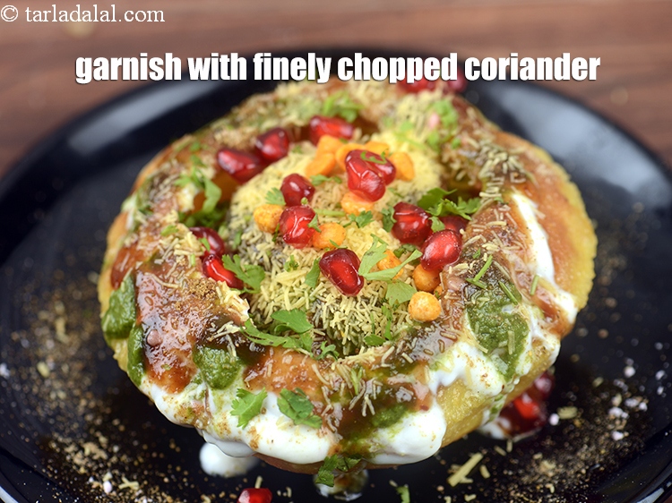 Step 55 – Finally, garnish with finely <a href="https://www.tarladalal.com/glossary-chopped-coriander-783i">chopped coriander (dhania)</a>.