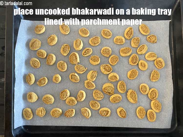 Step 52 – Place them on a&nbsp;baking tray lined with parchment paper.