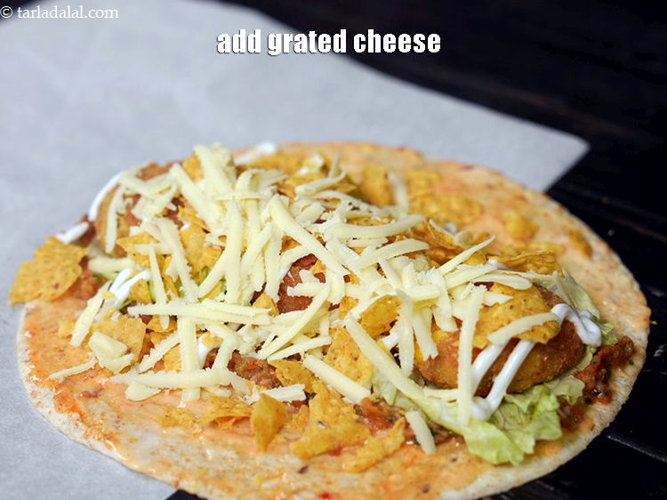 Step 53 – Finally add 1 tbsp&nbsp;<a href="https://www.tarladalal.com/glossary-grated-processed-cheese-868i">grated processed cheese</a>.&nbsp;