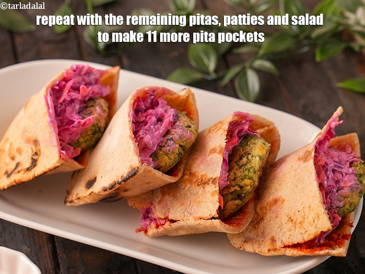 Step 54 – Repeat with the remaining pitas, patties and salad to make 11 more pita pockets.