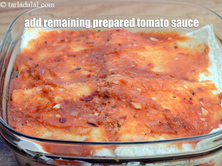 Step 54 – Finally add the remaining prepared tomato sauce and spread it evenly.