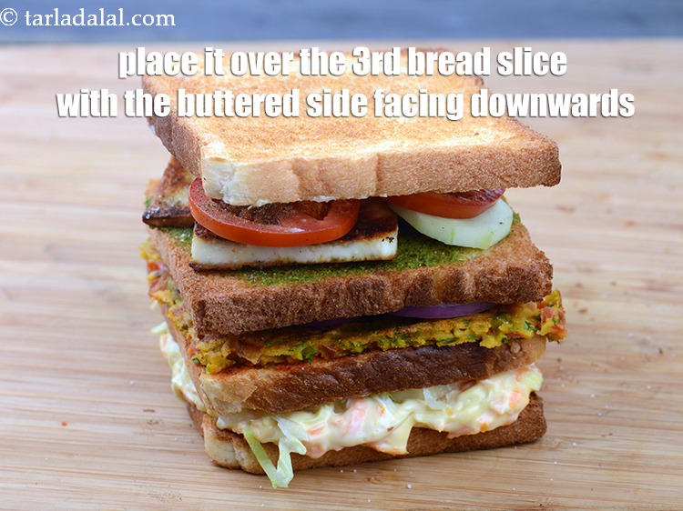 Step 54 – Place it over the 3rd bread slice containing paneer and veggies with the buttered side …