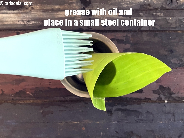 Step 54 – Grease the banana leaf with oil and place in a small steel container to hold …