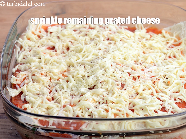 Step 55 – Sprinkle the remaining grated processed cheese.