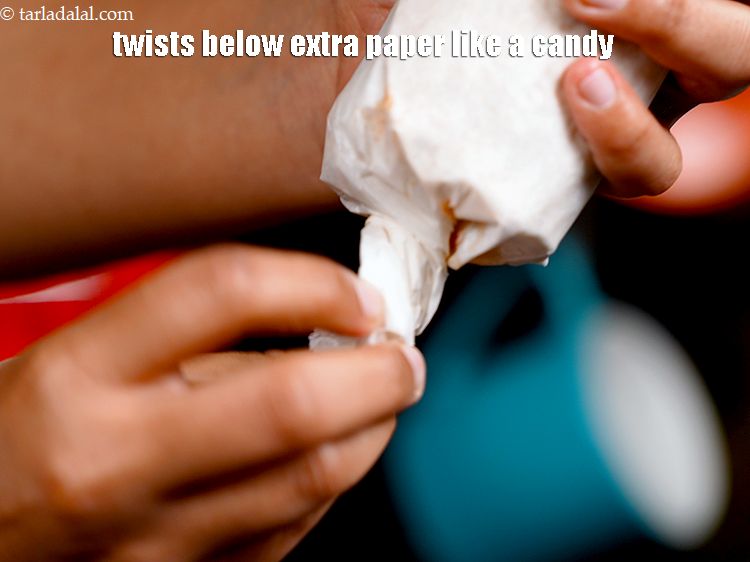 Step 55 – Twists the below extra paper like a candy.&nbsp;