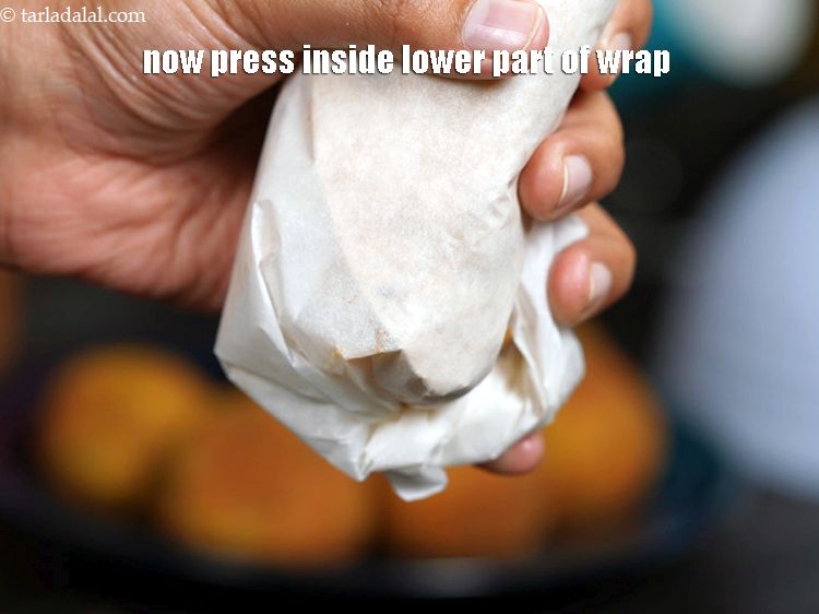 Step 56 – Now press it inside the lower part of the wrap as show in the image.&nbsp;