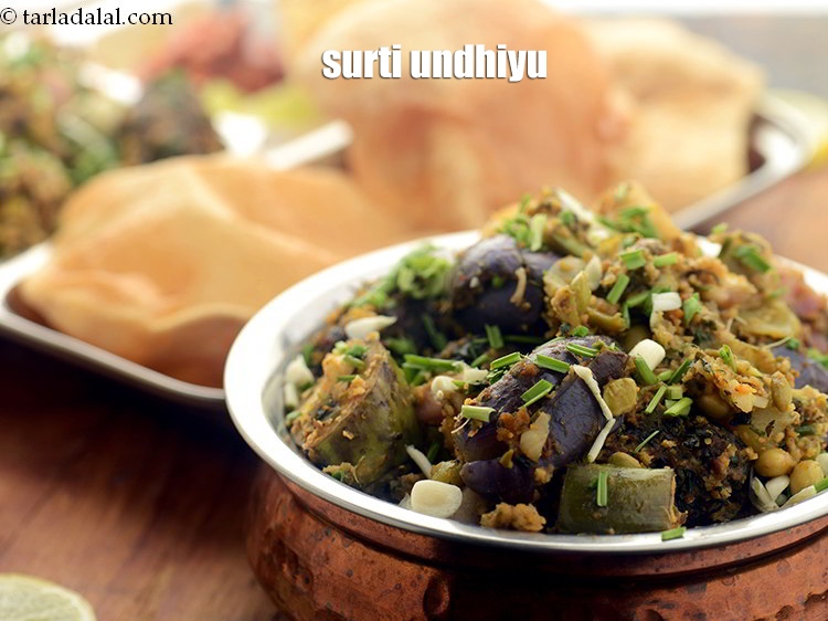 स्टेप 59 – <strong>उंधियू</strong> को धनिया से गार्निश करके गरमा गरम परोसें। इसे …