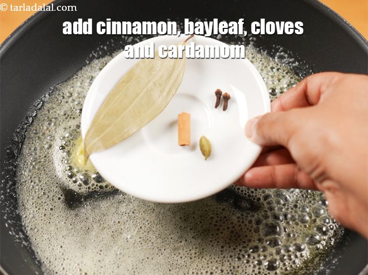 Step 7 – Add 1 small <a href="https://www.tarladalal.com/glossary-cinnamon-dalchini-346i">cinnamon (dalchini)</a>,&nbsp;1 bayleaf,&nbsp;2 cloves and&nbsp;1 cardamom.