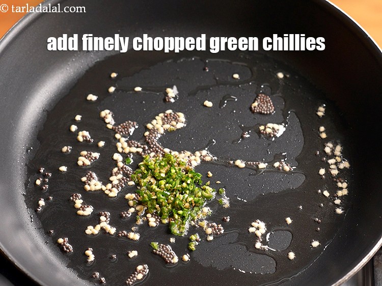 Step 8 – Add 1 tsp finely <a href="https://www.tarladalal.com/glossary-chopped-green-chilli-820i">chopped green chillies</a>.