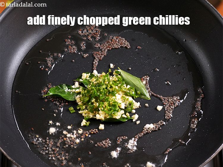 Step 7 – Add 1 tbsp finely <a href="https://www.tarladalal.com/glossary-chopped-green-chilli-820i">chopped green chillies</a>.&nbsp;