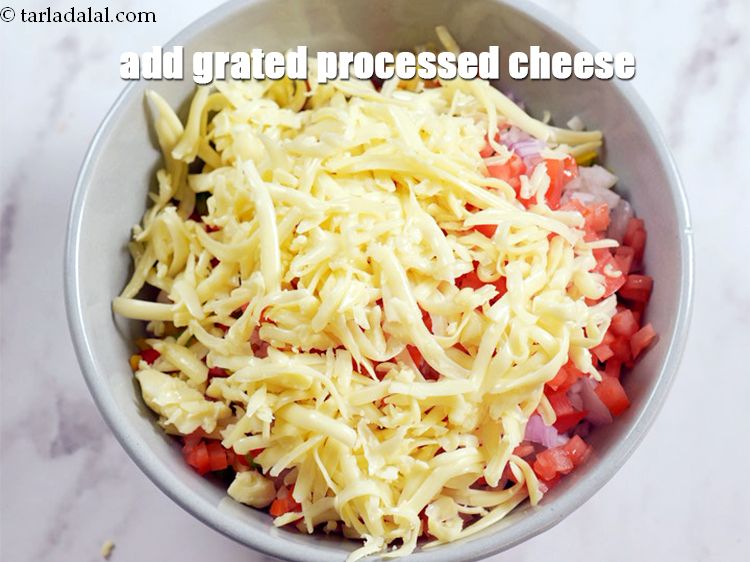 Step 8 – Add &frac34; cup <a href="https://www.tarladalal.com/glossary-grated-processed-cheese-868i">grated processed cheese</a>.