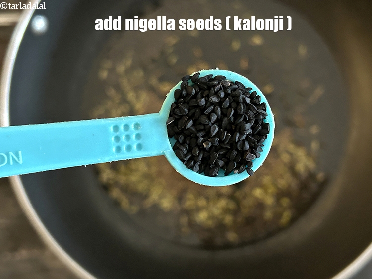 Step 7 – Add&nbsp;<meta charset="UTF-8" />1/2 tsp&nbsp;<a href="glossary-nigella-seeds-kalonji-onion-seeds-552i">nigella seeds (kalonji)</a>.
