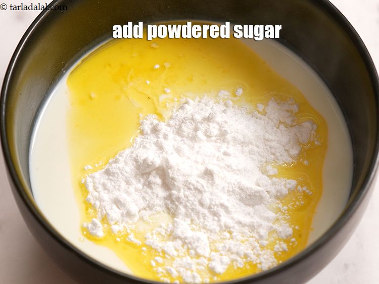 Step 7 – Add &frac12; cup <a href="https://www.tarladalal.com/glossary-powdered-sugar-280i">powdered sugar</a>.