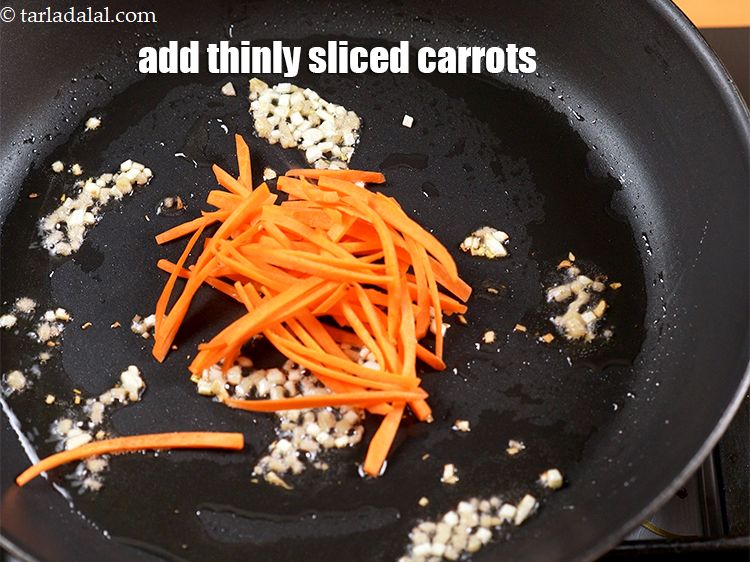 Step 8 – Add &frac14; cup thinly <a href="https://www.tarladalal.com/glossary-sliced-carrots-748i">sliced carrots</a>.