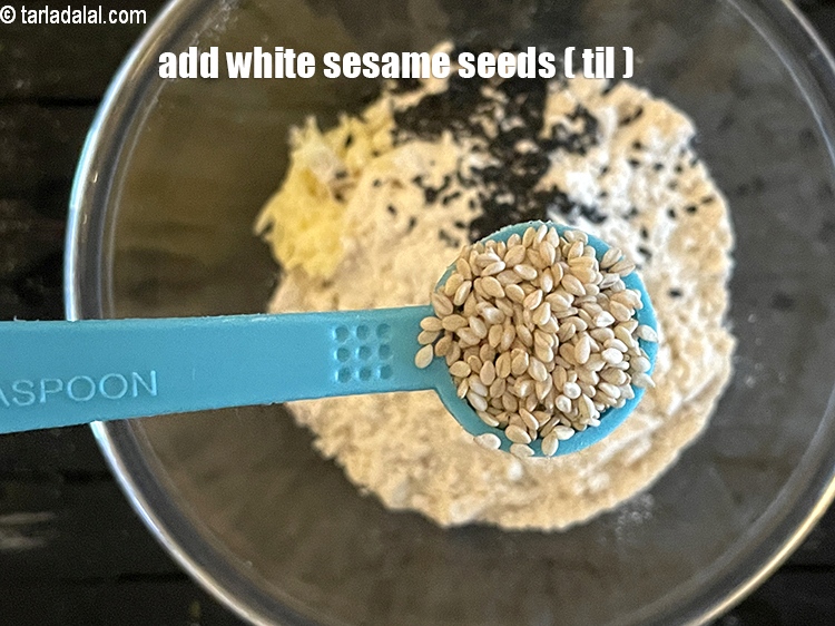 Step 7 – Add&nbsp;<meta charset="UTF-8" />1/2 tsp&nbsp;white&nbsp;<a href="glossary-sesame-seeds-til-gingelly-seeds-612i">sesame seeds (til)</a>.