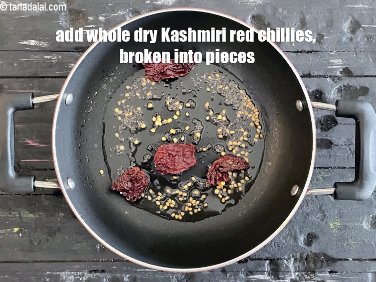 Step 19 – Add&nbsp;<meta charset="UTF-8" />2&nbsp;<a href="glossary-whole-dry-kashmiri-red-chillies-kashmiri-mirch-kashmiri-lal-mirch-332i">whole dry kashmiri red chillies</a>&nbsp;, broken into pieces.