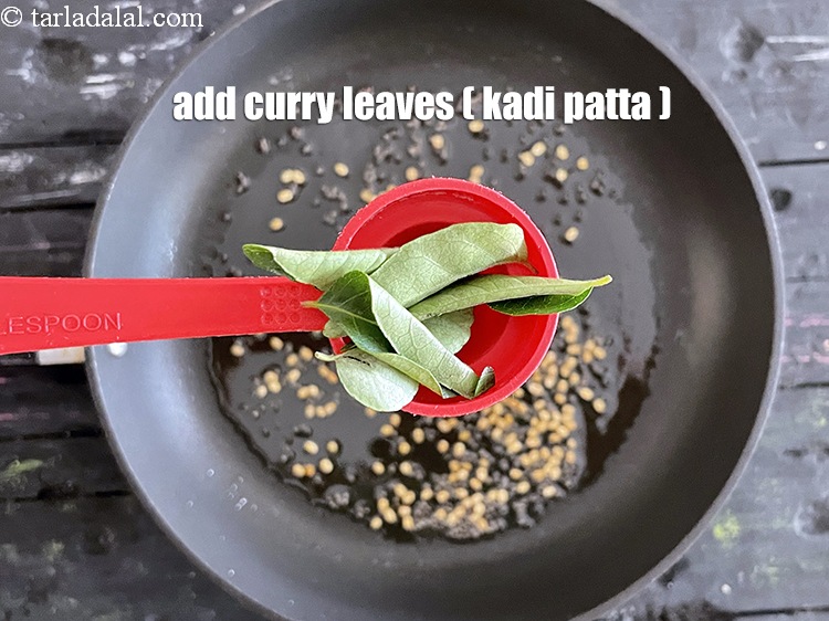Step 50 – Add&nbsp;<meta charset="UTF-8" />5&nbsp;<a href="glossary-curry-leaves-kadi-patta-kadipatta-388i">curry leaves (kadi patta)</a>.