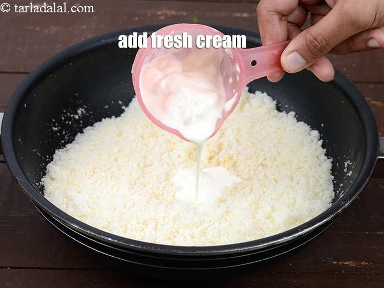 Step 8 – Add &frac12; cup&nbsp;<a href="https://www.tarladalal.com/glossary-fresh-cream-1877i">fresh cream</a>. Fresh cream provides required moisture to the barfi which makes …