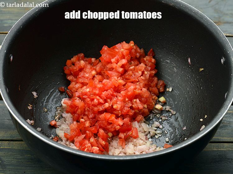 Step 12 – Add 1 1/4 cups&nbsp;finely&nbsp;<a href="https://www.tarladalal.com/glossary-chopped-tomatoes-779i">chopped tomatoes</a>.