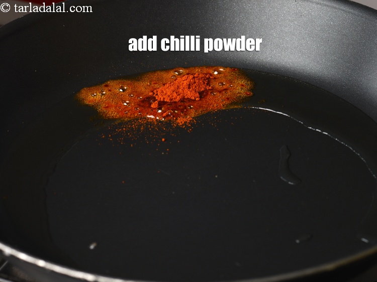 Step 8 – Add &frac12; tsp <a href="https://www.tarladalal.com/glossary-chilli-powder-red-chilli-powder-339i">chilli powder</a>.&nbsp;