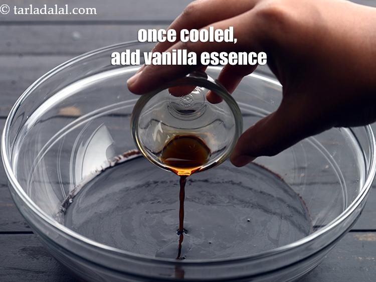 Step 7 – Once cooled, add 1 tsp <a href="https://www.tarladalal.com/glossary-vanilla-essence-406i">vanilla essence</a>.