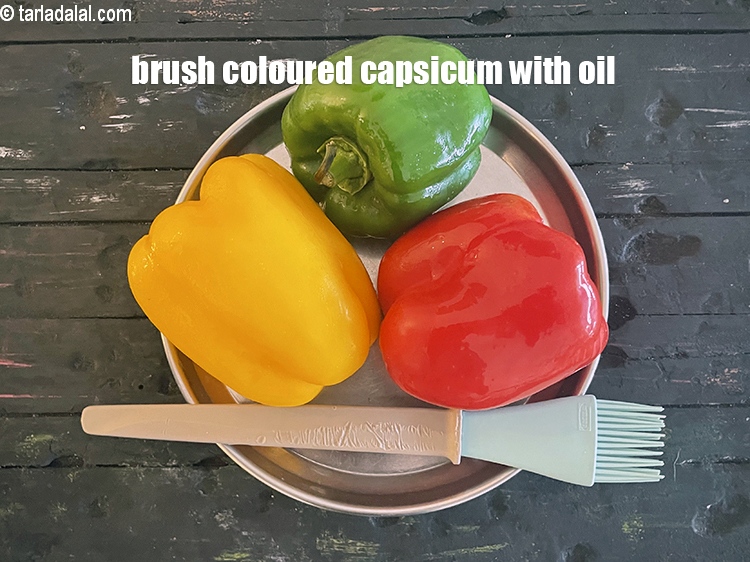 Step 7 – <meta charset="UTF-8" /> To make roasted capsicum, brush the capsicum (red, yellow and green) with …
