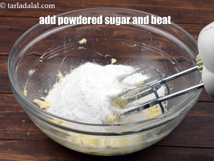 Step 8 – Add 1 cup&nbsp;<a href="https://www.tarladalal.com/glossary-powdered-sugar-280i">powdered sugar</a> and beat for a minute.