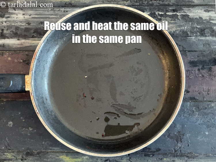 Step 17 – Re- use and reheat the same&nbsp;oil in a broad non-stick pan.
