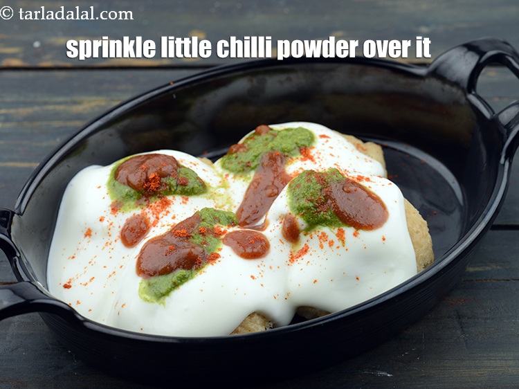 Step 67 – Sprinkle little&nbsp;<a href="https://www.tarladalal.com/glossary-chilli-powder-red-chilli-powder-339i">chilli powder</a>&nbsp;evenly over it.