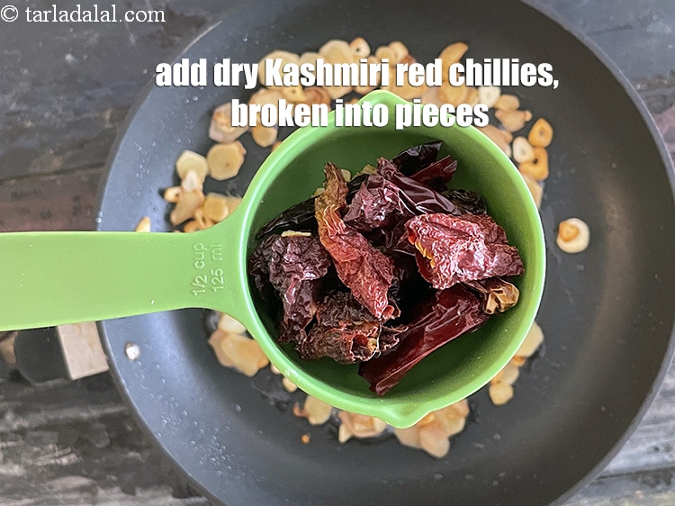 Step 7 – Add&nbsp;<meta charset="UTF-8" />4 to 5&nbsp;<a href="glossary-whole-dry-kashmiri-red-chillies-kashmiri-mirch-kashmiri-lal-mirch-332i">whole dry kashmiri red chillies</a>&nbsp;, broken into pieces.