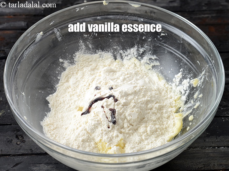 Step 7 – Add &frac14; tsp <a href="https://www.tarladalal.com/glossary-vanilla-essence-406i">vanilla essence</a>.