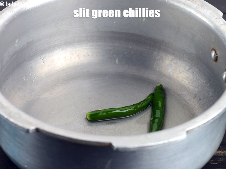 Step 7 – Add 2&nbsp;<a href="https://www.tarladalal.com/glossary-slit-green-chillies-1856i">slit green chillies</a>.