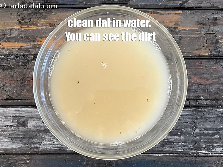 Step 7 – Add water and clean the dals. You can see lots of dirt.