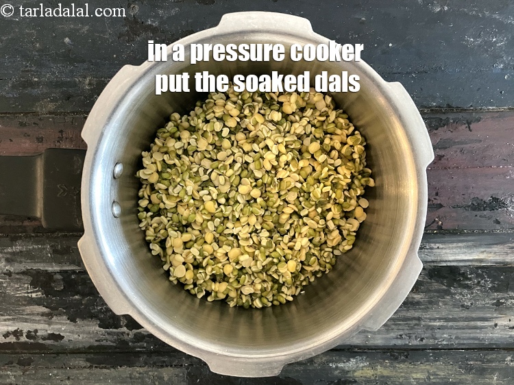Step 7 – In a pressure cooker put the soaked and drained dals.