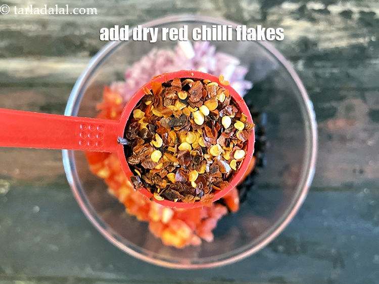 Step 21 – Add&nbsp;1 tbsp&nbsp;<a href="glossary-dry-red-chilli-flakes-paprika-338i">dry red chilli flakes (paprika)</a>.