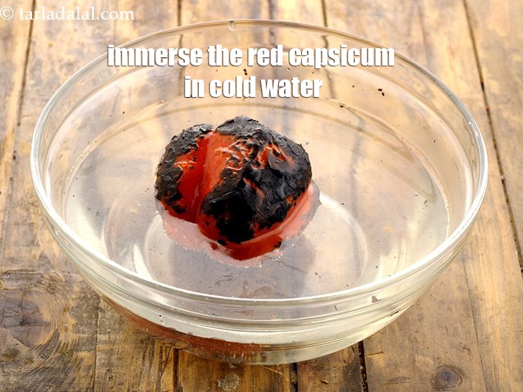 Step 7 – Immerse the red capsicum in cold water.