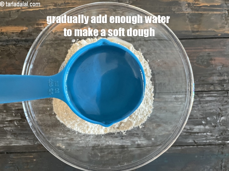 Step 8 – Gradually add enough water to make a soft dough. We added 1/3rd cup water and …