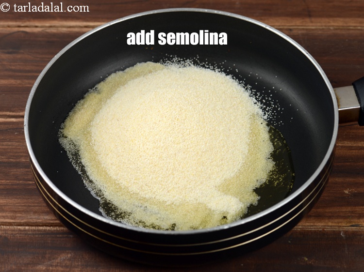 Step 9 – Add &frac34; cup <a href="https://www.tarladalal.com/glossary-semolina-sooji-rava-rawa-603i">semolina (rava / sooji)</a>.