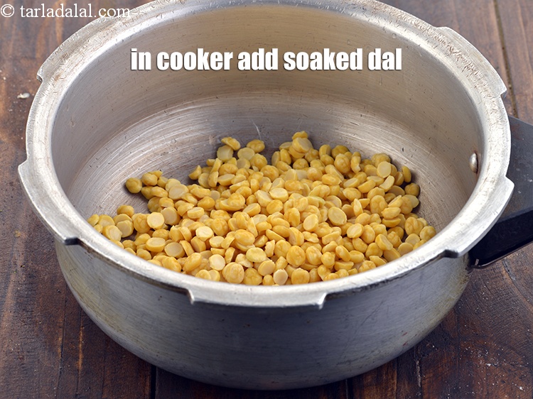 Step 7 – In a pressure cooker add the soaked chana dal.