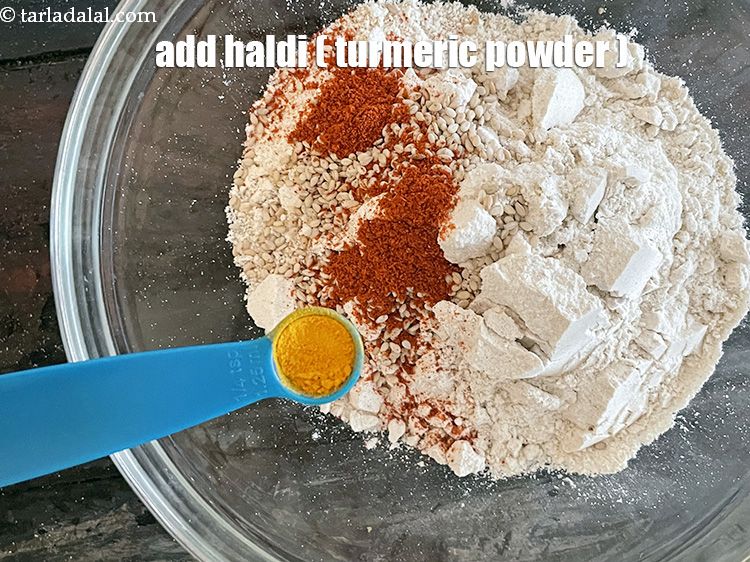 Step 11 – Add&nbsp;a pinch of&nbsp;<a href="glossary-turmeric-powder-haldi-645i">turmeric powder (haldi)</a>.