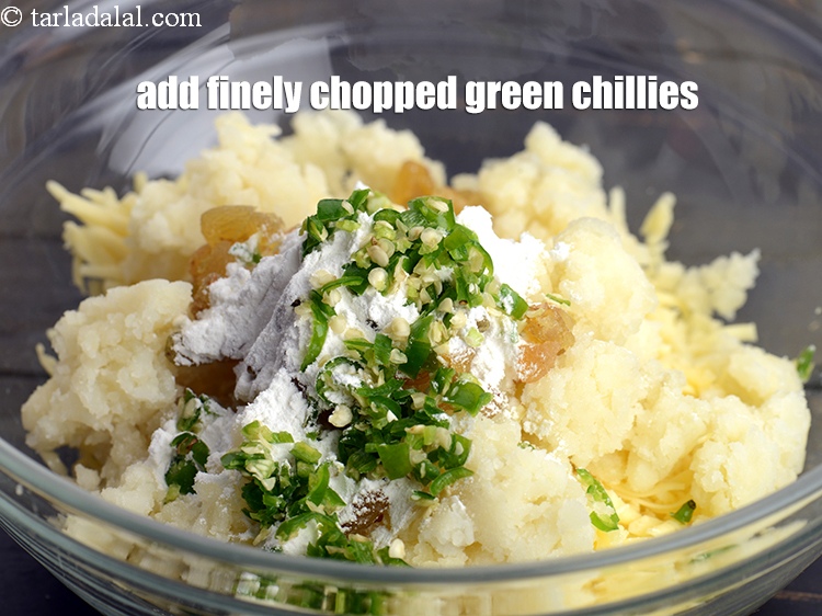 Step 8 – Add 2 tsp finely <a href="https://www.tarladalal.com/glossary-chopped-green-chilli-820i">chopped green chillies</a>.