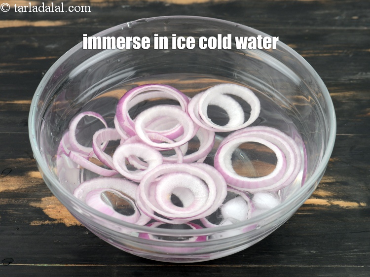 Step 7 – Immerse the onion rings in the ice cold water. This makes them crisp.